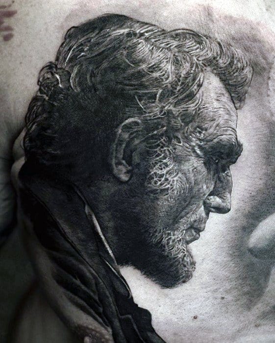 Tattoo of Abraham Lincoln's profile with detailed shading and texture
