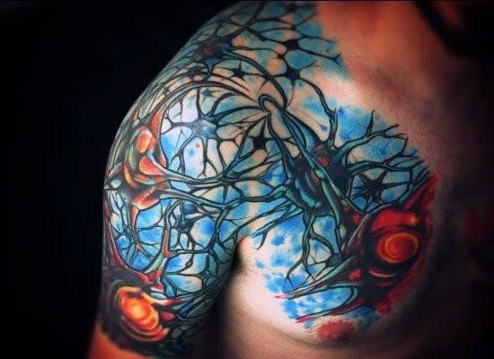Vivid neuron tattoo across shoulder and chest with electric blue background, glowing red-orange synapses, and branching axons.