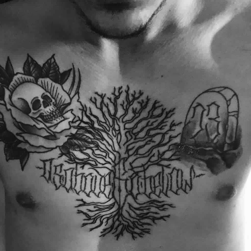 Chest tattoo with 'As Above So Below,' a tree of life, a skull in a rose, and a gravestone, symbolizing balance and duality