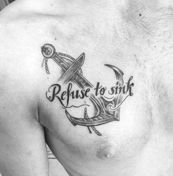Chest tattoo featuring the phrase "Refuse to Sink" alongside a detailed anchor design with rope