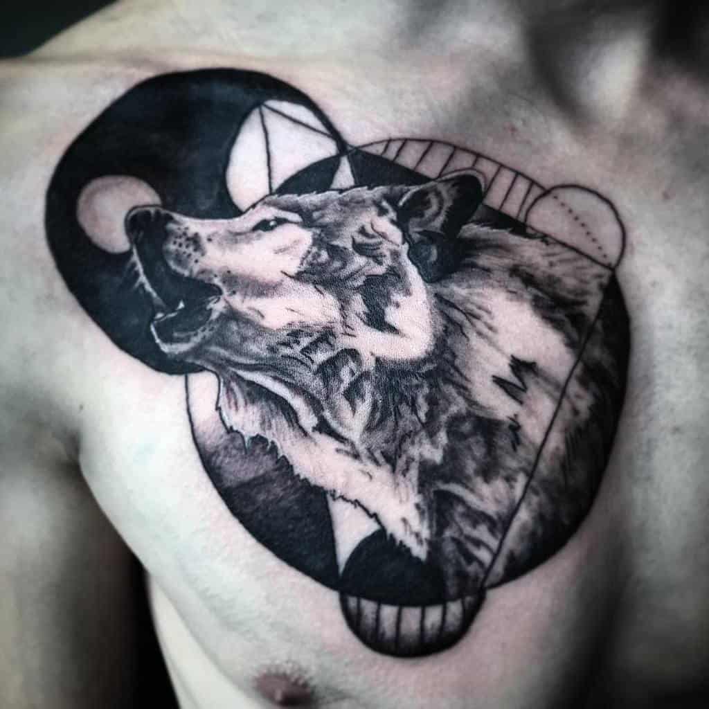 A striking black and white wolf tattoo graces a person's chest, intricately woven with geometric shapes and the harmonious yin-yang design
