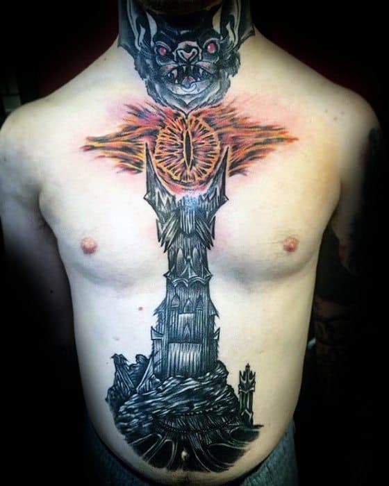 Man with a detailed chest tattoo of a fantasy tower and the Eye of Sauron, featuring a bat at the top