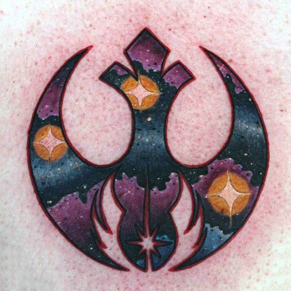 Tattoo of a galaxy-themed Star Wars Rebel Alliance symbol with stars inside