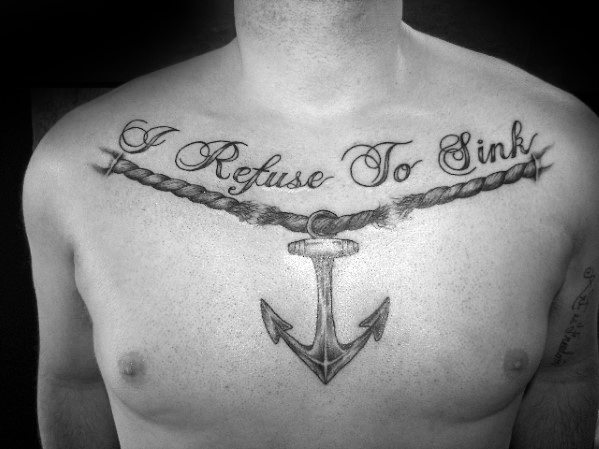 Chest tattoo with "Refuse To Sink" and an anchor beneath it