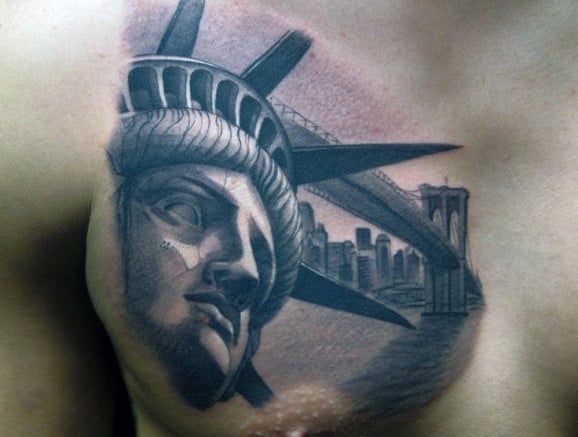 Chest Statue Of Liberty Tatto With New York City In Background