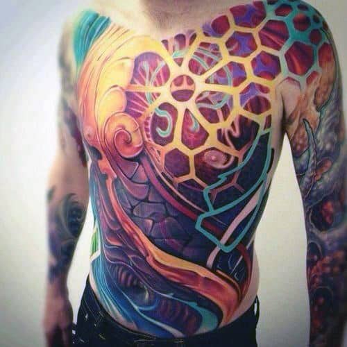 A vibrant, full chest tattoo featuring geometric shapes and abstract designs