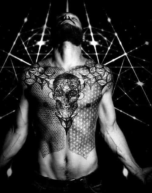 Man with geometric and skull tattoos on chest