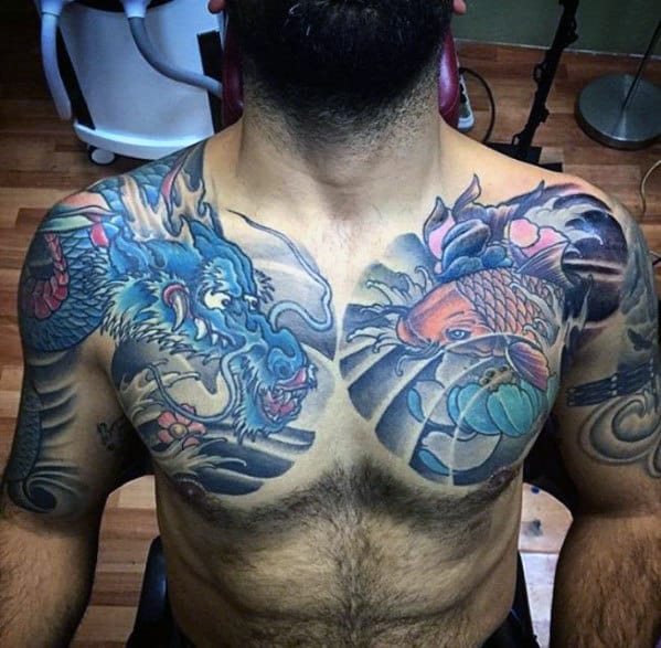 Man with colorful dragon and koi fish tattoos on his chest