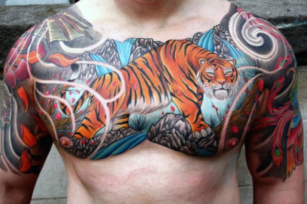 Colorful tiger chest tattoo with nature and abstract designs around it