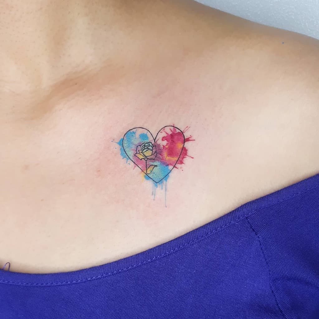 Heart-shaped watercolor tattoo with a rose, on a shoulder