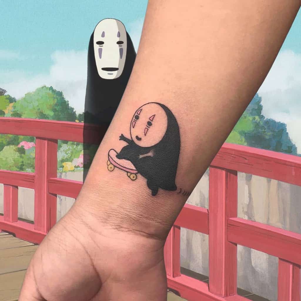 Tattoo of masked character skateboarding