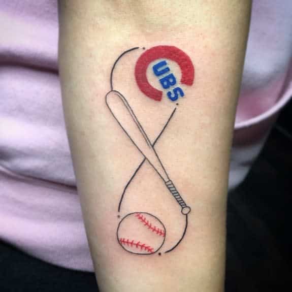 This tattoo combines the infinity symbol with elements related to baseball, featuring a bat and ball, as well as the iconic "Cubs" logo, likely referencing the Chicago Cubs baseball team. The design reflects both a love for the sport and a connection to the team.