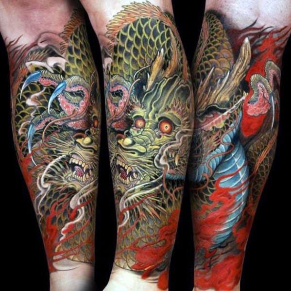 Detailed dragon tattoos on forearms with vibrant red and green colors