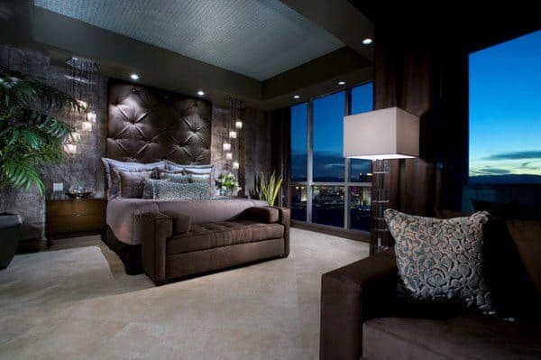 luxury apartment bedroom with ottoman 