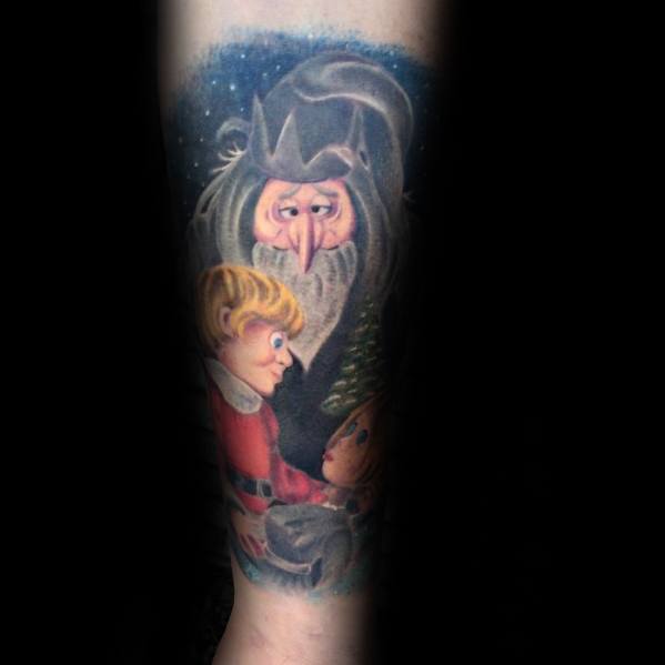 Christmas tattoo featuring the Winter Warlock from *Santa Claus Is Comin’ to Town*, with a magical, nostalgic scene set against a snowy backdrop.