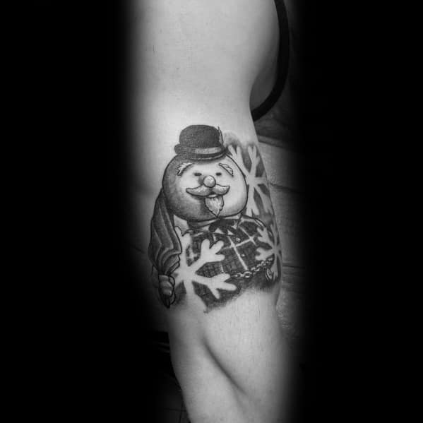 Black and grey Christmas tattoo of a cheerful snowman wearing a top hat and scarf, with snowflake accents for a classic holiday look.
