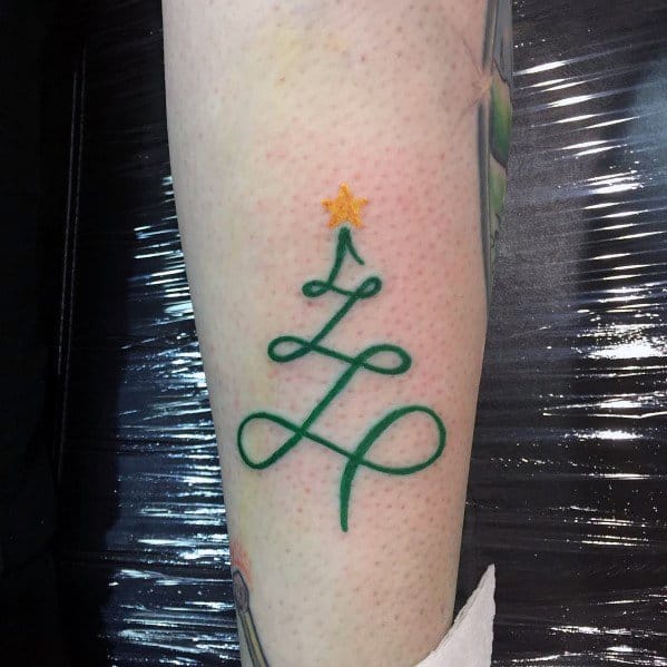 Minimalist Christmas tree tattoo with a continuous green line forming the tree shape, topped with a small golden star for a simple, elegant design.