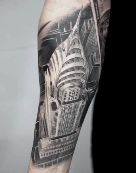 Realistic Chrysler Building tattoo shown from an aerial perspective, featuring precise lines and bold shading for a sleek, modern look.