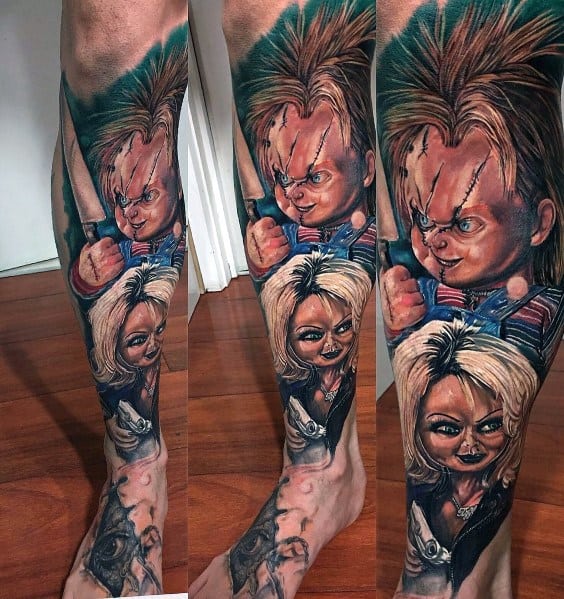 Chucky and Tiffany full-leg tattoo with vivid colors, intense expressions, and detailed shading, creating a bold horror-inspired design.