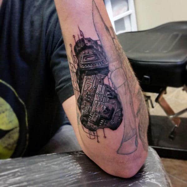 Circuit Board Pieces Tattoo On Mans Forearm