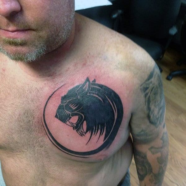 Circular Tribal Lion Male Tattoo On Chest