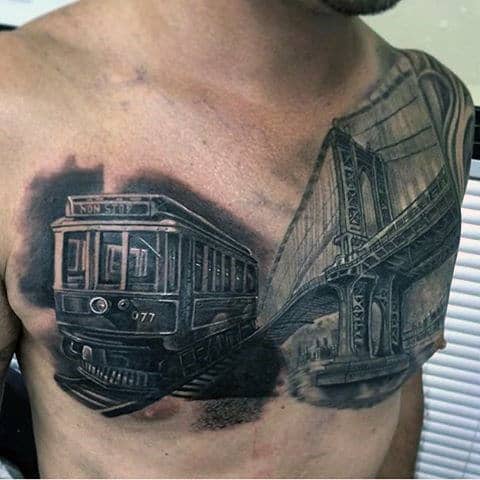 City Train Tattoo For Males On Chest With Bridge