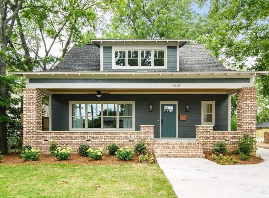 green brick classic craftsman style house