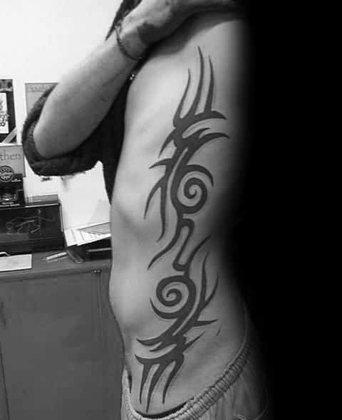 Classic Solid Black Ink Male Decorative Tribal Rib Cage Tattoo Inspiration