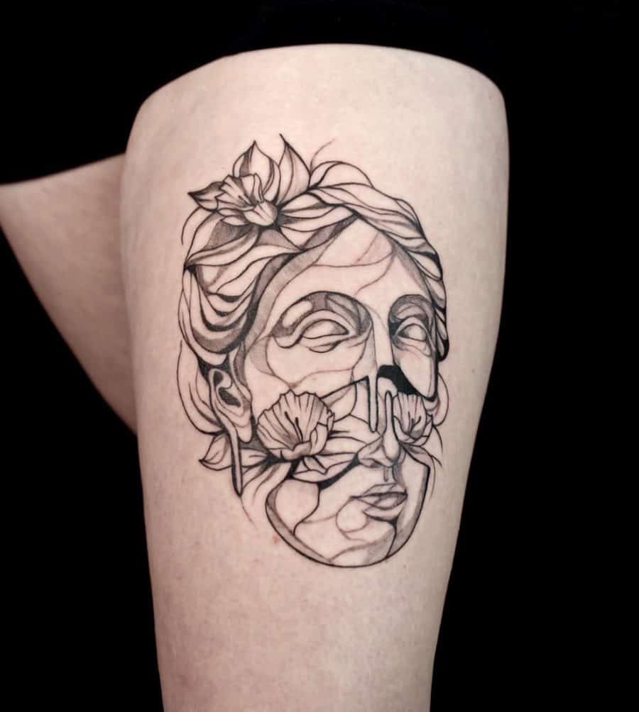 A stunning geometric tattoo featuring a fragmented portrait of a face, with daffodils blooming near the nose, blending nature with abstract art.