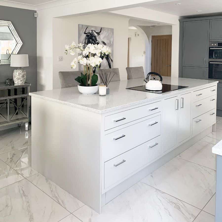 classy kitchen gray cabinets large white island with drawers