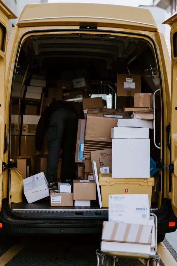 Packages Shipping in the back of a van - How Online Tracking and AI Forecasting Enhance the Customer Experience
