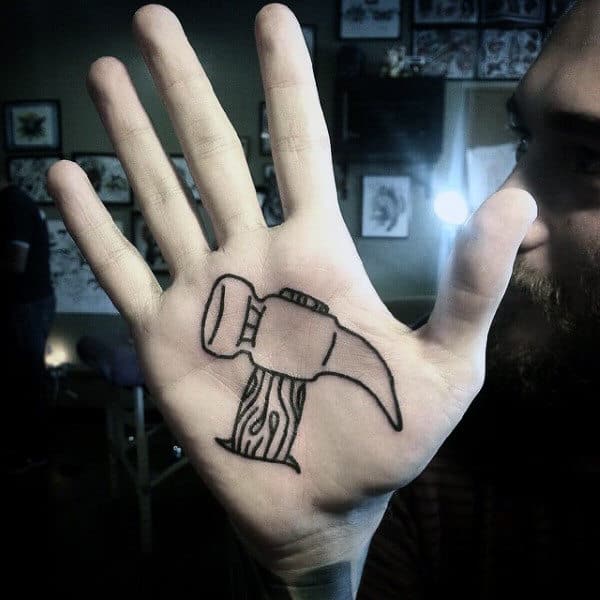 Claw Hammer Tattoo On Palm Of Mans Hand