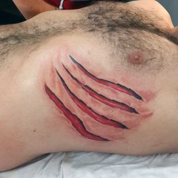 Claw Red Torn Ripped Skin Tattoo Designs On Upper Ribs