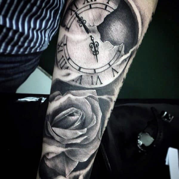 Tattoo of a clock and rose on a forearm
