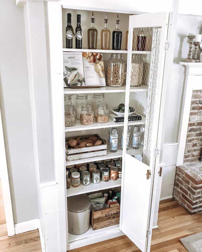 white kitchen cabinet with mesh