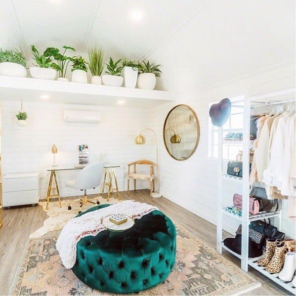 elegant office closet clothes rack plants gold accents