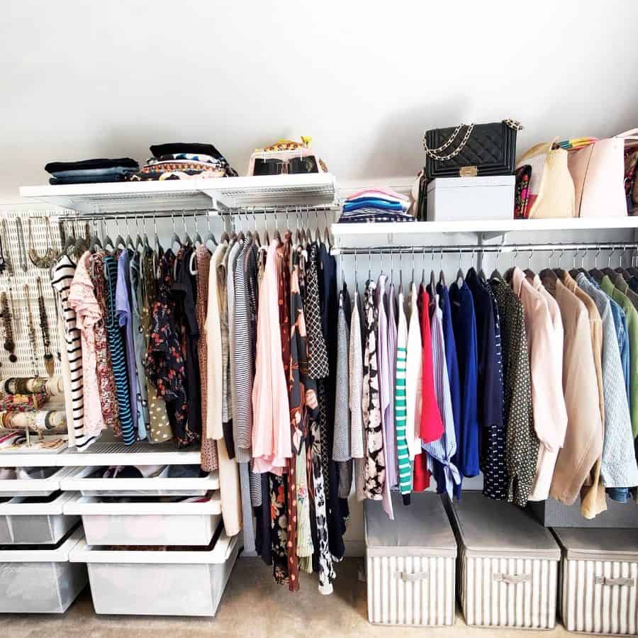 Organized women's closet with hanging clothes, storage bins, and accessories.