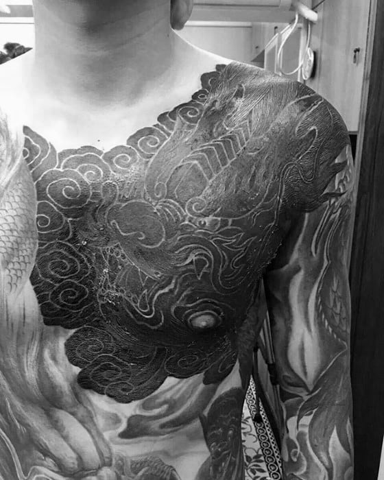 Clouds With Dragon Blackwork White Ink Mens Chest Tattoos