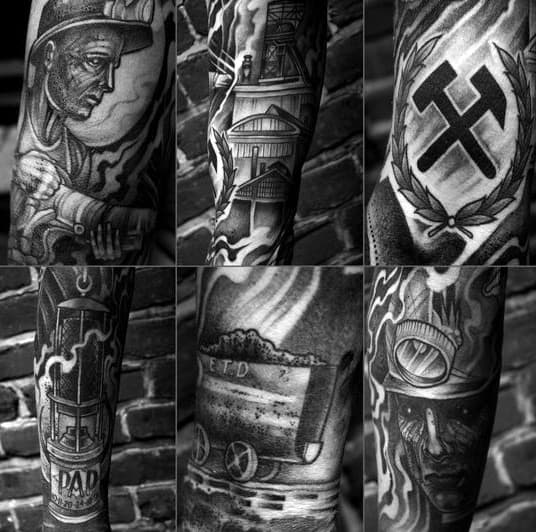 Black and grey sleeve tattoo featuring a miner, coal cart, lantern, mining helmet, pithead, and pickaxe symbol with laurel wreath.