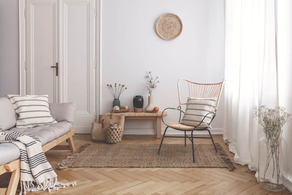 coastal theme farmhouse living room wood sofa wicker chair 