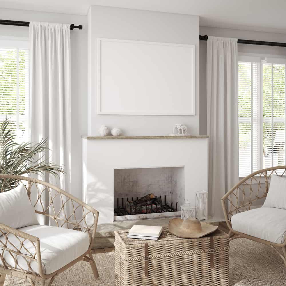 relaxed farmhouse living room white fireplace wicker furniture 