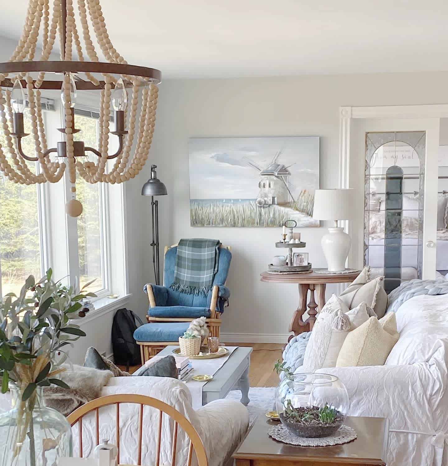 coastal farmhouse white sofa chandelier blue accent char black floor lamp 