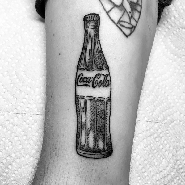 Minimalist black and grey Coca-Cola bottle tattoo with fine linework and dot shading, creating a classic vintage-inspired design.