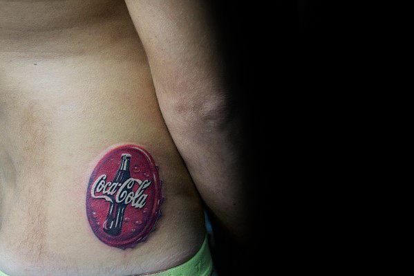 Small, realistic Coca-Cola bottle cap tattoo with a 3D effect, featuring bold red tones and detailed highlights for a vintage-inspired look.