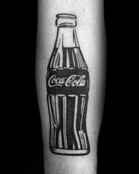 Bold black and white Coca-Cola bottle tattoo with strong linework and contrast, creating a classic and timeless vintage-inspired design.