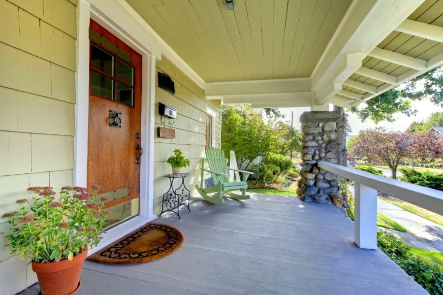 front porch wood deck with rocking chair 