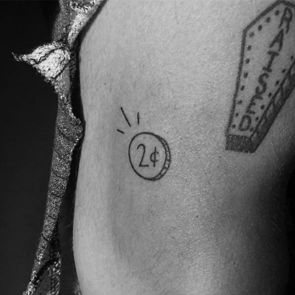 Minimalist tattoo of a small 2-cent coin with simple linework and radiating lines, symbolizing personal opinions or contributions.