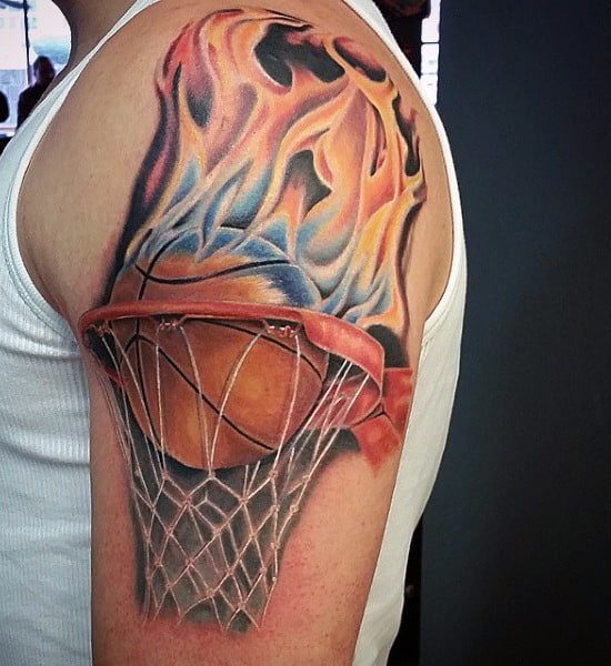 Tattoo of a basketball on fire going through a net on an upper arm
