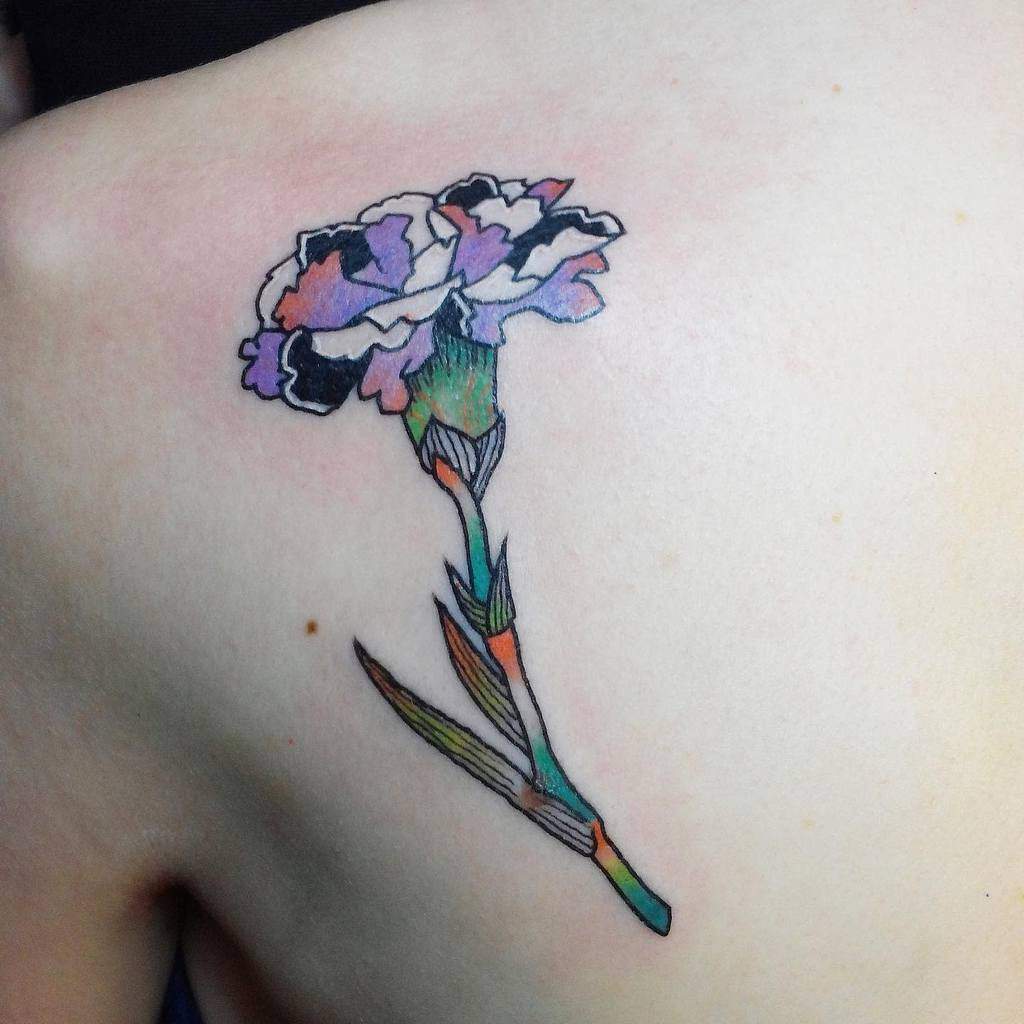 A colorful carnation tattoo, featuring a blend of purple, pink, and blue tones on the petals and a multicolored stem