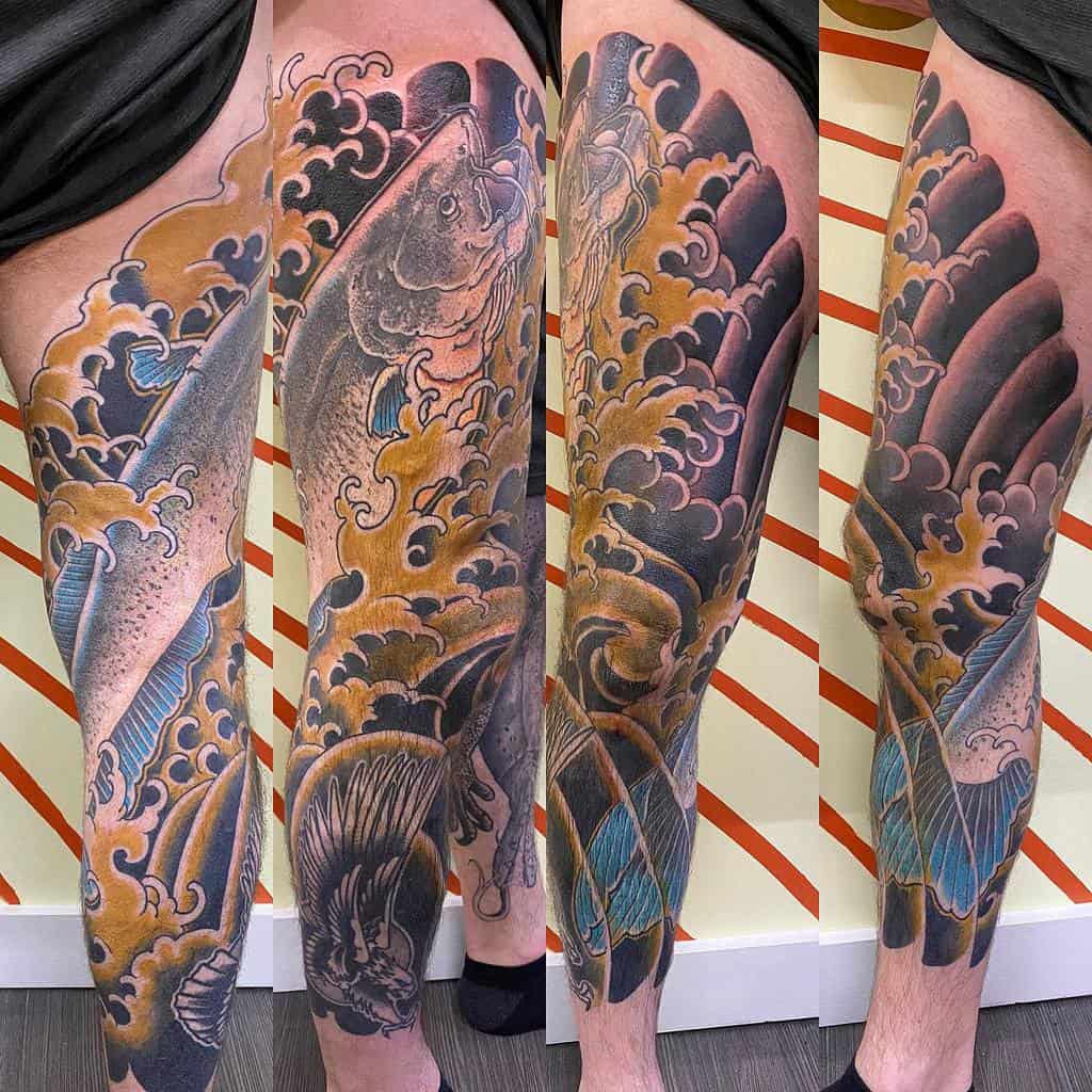 Full leg sleeve tattoo featuring a colorful koi fish, waves, and intricate patterns